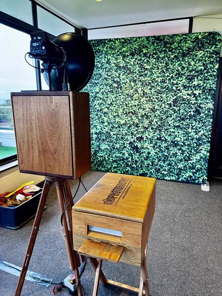 The Retrobooth and printer in front of a green foliage wall backdrop at a Durban venue