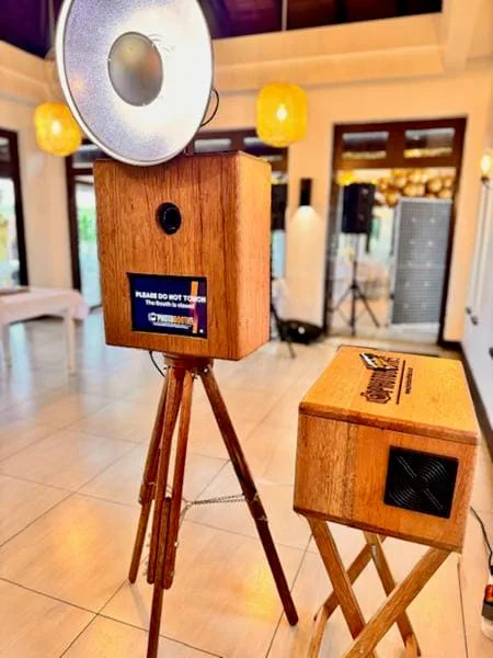 The wooden Retrobooth on its tripod with a silver ring flash and printer box at a KZN venue