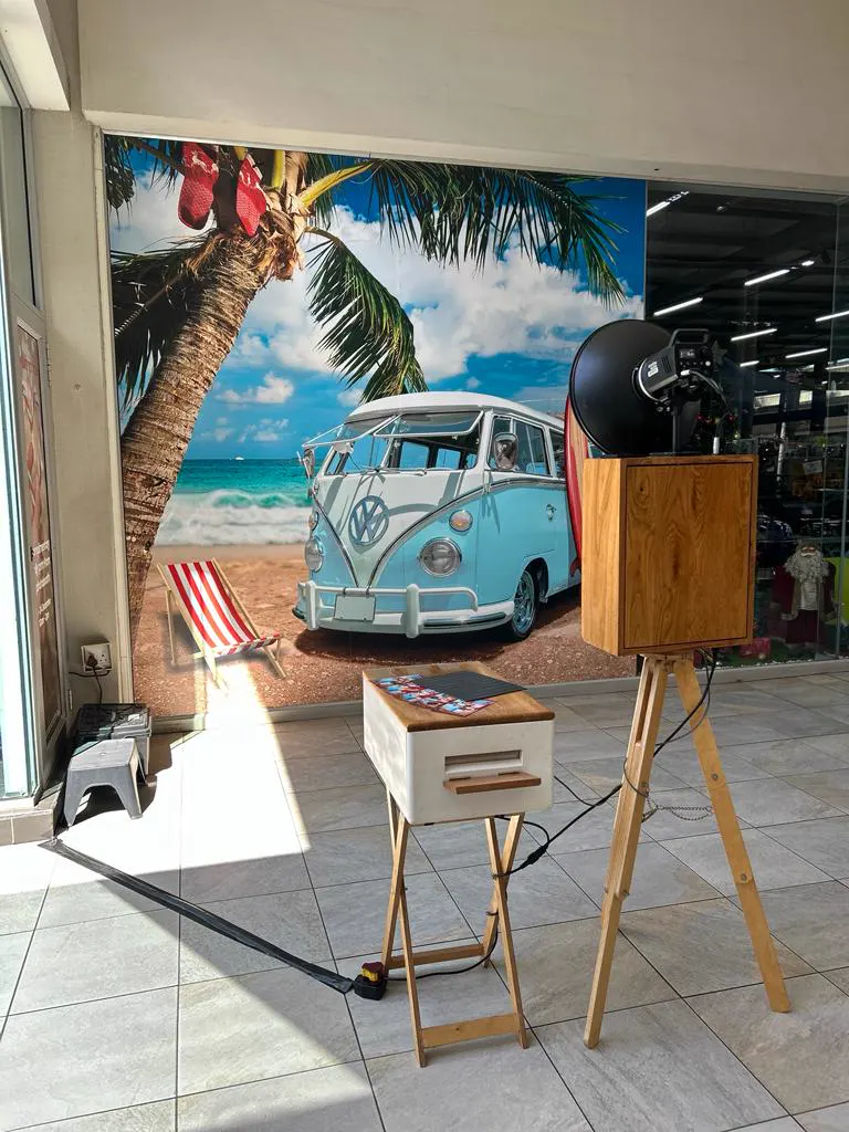 The Retrobooth in front of a tropical beach and VW camper backdrop at a shopping centre activation