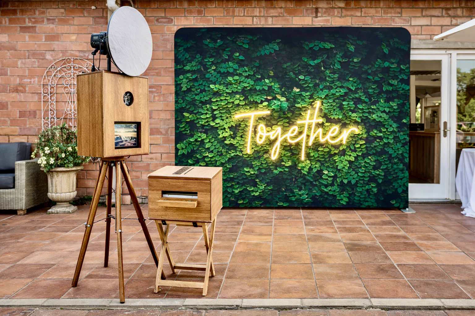 The Retrobooth retro photobooth beside a Better Together neon foliage backdrop at a Durban wedding venue